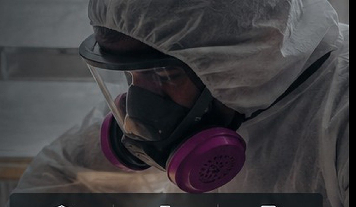 Capsule Corps asbestos inspector wearing protective equipment